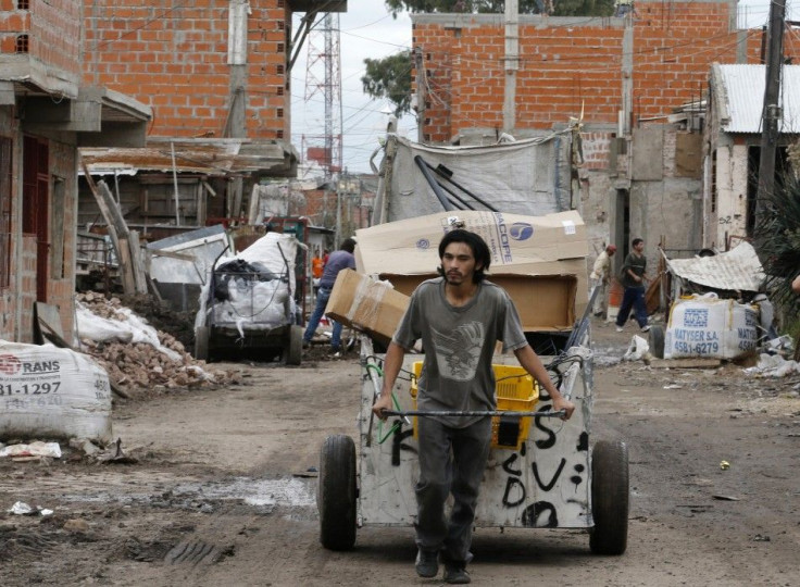 A garbage collector pulls his cart at a shantytown in Buenos Aires May 3, 2014