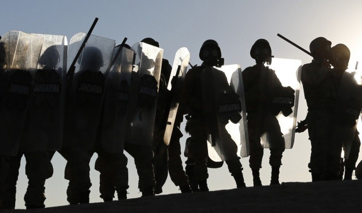 Turkish soldiers take position as they clash with Turkish Kurdish protesters near the Mursitpinar border crossing on the Turkish-Syrian border in the Turkish town of Suruc in southeastern Sanliurfa province October 4, 2014. Turkish security forces broke u