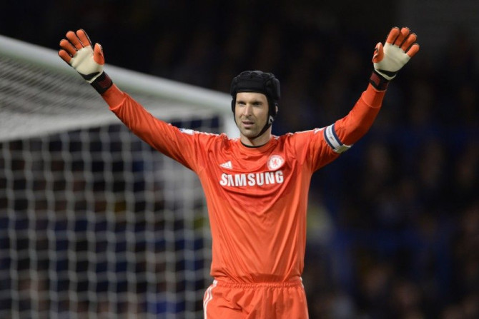 Chelsea's Petr Cech waves his arms during the English League Cup soccer match against Bolton Wanderers at Stamford Bridge in London September 24, 2014