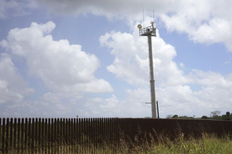 A U.S. Border Patrol surveillance tower looms over a border fence at a camp of &quot;Patriots&quot; near the U.S. - Mexico border outside Brownsville, Texas September 2, 2014. The &quot;Patriots&quot; are a heavily armed group who patrol the U.S. border w