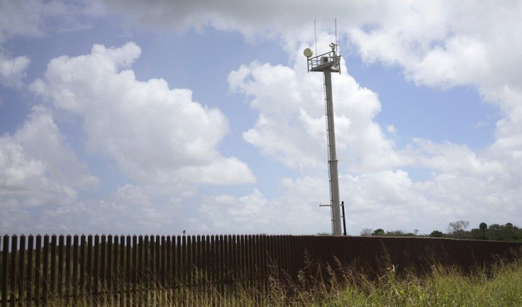 A U.S. Border Patrol surveillance tower looms over a border fence at a camp of &quot;Patriots&quot; near the U.S. - Mexico border outside Brownsville, Texas September 2, 2014. The &quot;Patriots&quot; are a heavily armed group who patrol the U.S. border w