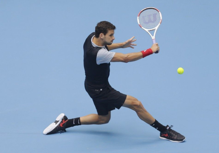 Grigor Dimitrov of Bulgaria returns the ball during his men&#039;s quarter-final match against Novak Djokovic of Serbia at the China Open tennis tournament in Beijing, October 3, 2014. REUTERS/Jason Lee