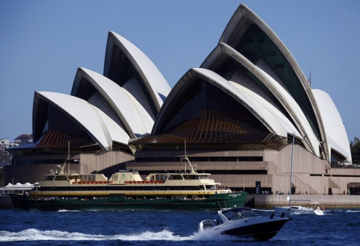 A ferry and recreational boats pass in front of the Sydney Opera House September 28, 2014. Local media reported that the Sydney Opera House Trust has been awarded an AUD$225,000 ($200,000) grant by the U.S. philanthropic organisation, the Getty Foundation