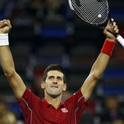 Novak Djokovic of Serbia reacts after winning his men's singles tennis match against Dominic Thiem of Austria at the Shanghai Masters tennis tournament in Shanghai October 8, 2014. REUTERS/Aly Song