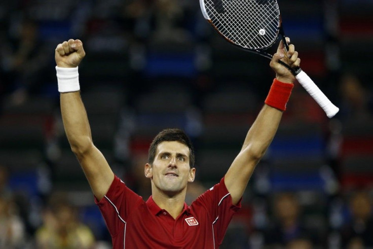 Novak Djokovic of Serbia reacts after winning his men's singles tennis match against Dominic Thiem of Austria at the Shanghai Masters tennis tournament in Shanghai October 8, 2014. REUTERS/Aly Song