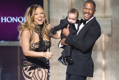 BET honoree musician Mariah Carey laughs with her husband Nick Cannon and their son Moroccan Scott Cannon at the BET Honors in Washington January 14, 2012.