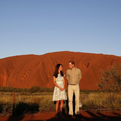 Britain's Prince William and his wife Catherine, Duchess of Cambridge, pose in front of Uluru