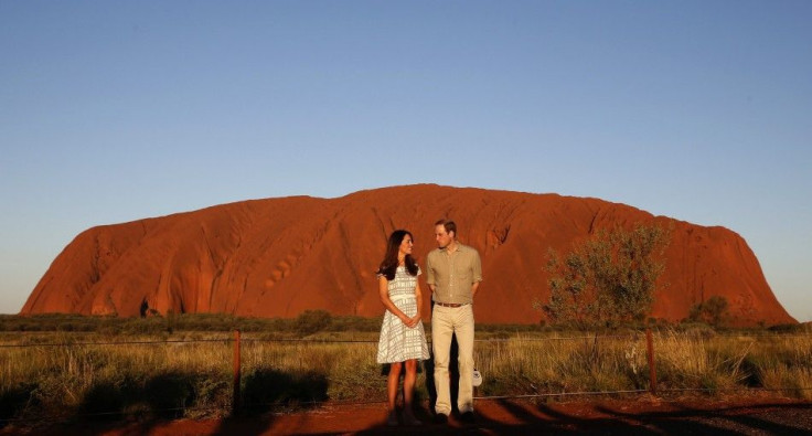 Britain's Prince William and his wife Catherine, Duchess of Cambridge, pose in front of Uluru