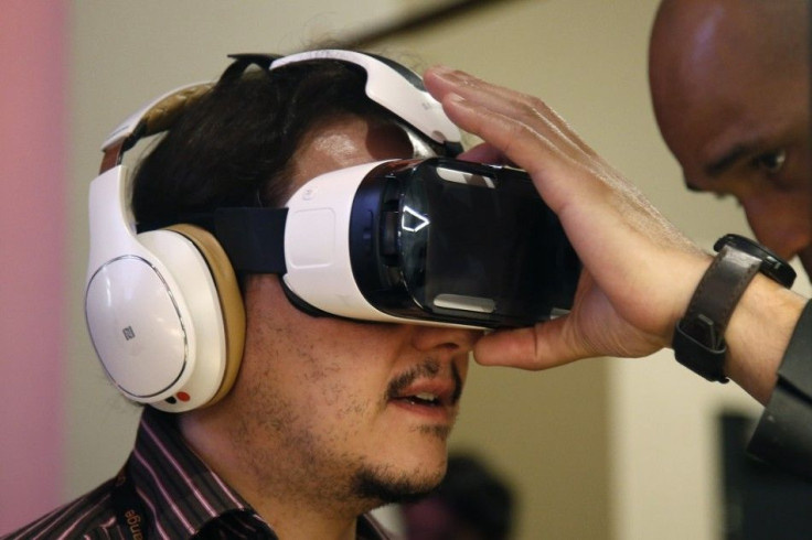 An attendee tries an Oculus-powered Samsung Gear VR headset during the French telecom Orange annual company's innovations show in Paris October 2, 2014.