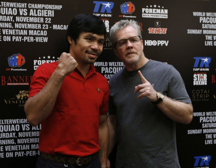 Manny Pacquiao (L) from the Philippines and his trainer Freddie Roach pose during an interview at Venetian Macao in Macau August 25, 2014. Pacquiao will fight for the WBO welterweight title against Chris Algieri from the United States at the Venetian&#039