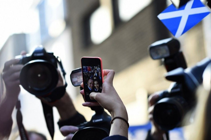 Scotland's First Minister Alex Salmond poses for a selfie as he meets supporters during a walkabout in Perth, central Scotland, September 12, 2014. The referendum on Scottish independence will take place on September 18, when Scotland will vote whether or