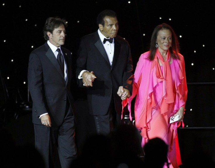 Muhammed Ali (C) is escorted on stage by his wife Lonnie Ali (R) and a personal assistant during The Muhammad Ali Celebrity Fight Night Awards XIX in Phoenix, Arizona March 23, 2013. The awards are given out to celebrities who embody the qualities of Ali 