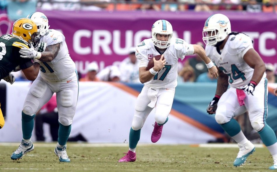 Miami Dolphins quarterback Ryan Tannehill scrambles 