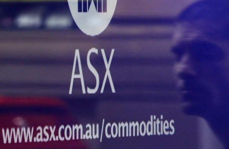 A man is reflected as he walks past the Australian Securities Exchange building in central Sydney April 8, 2011. Singapore Exchange Ltd has terminated its $8 billion bid for Australia's ASX Ltd after the Australian government formally rejected the offer o