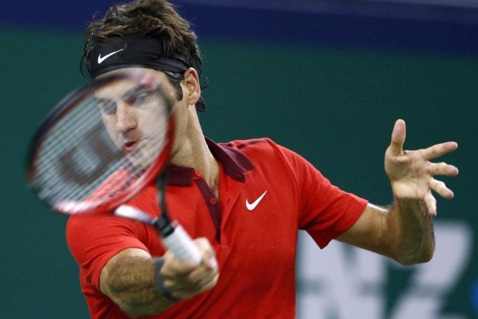 Roger Federer of Switzerland returns a shot 