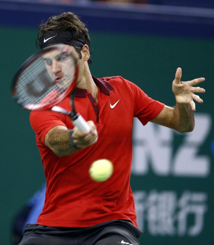 Roger Federer of Switzerland returns a shot 