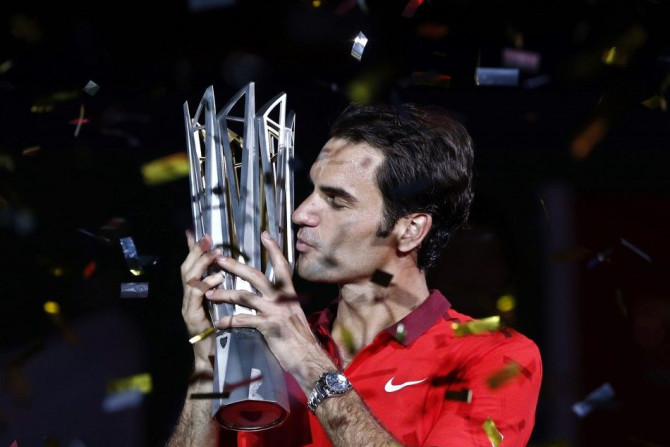 Roger Federer of Switzerland kisses the trophy 