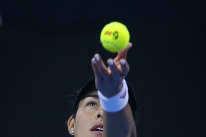 Ana Ivanovic of Serbia serves to Maria Sharapova of Russia during their women's singles semi-final match at the China Open tennis tournament in Beijing October 4, 2014. REUTERS/Petar Kujundzic