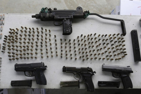 Firearms and ammunition are displayed after a police raid inside Nueva Esperanza prison, in Colon City September 30, 2014. Panama&#039;s national police raided one of the most dangerous prisons in Panama seizing illegal weapons, knives, firearms, a grenad