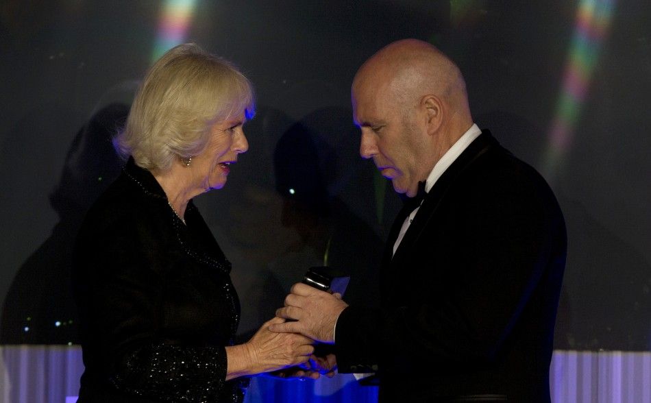 Camilla, Duchess of Cornwall, presents Australian author Richard Flanagan, who wrote quotThe Narrow Road to the Deep Northquot, with the trophy for the 2014 Man Booker Prize for Fiction at the Guildhall in London, October 14, 2014.