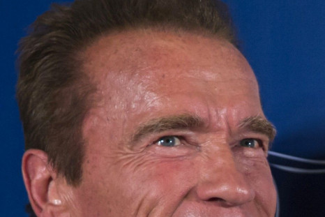 Cast member Arnold Schwarzenegger arrives on the red carpet for the special screening of &quot;The Expendables 3&quot;