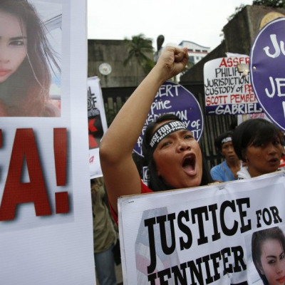 Protesters chant anti U.S. slogans during a rally against the killing of a 26-year-old Filipino transgender Jennifer Laude
