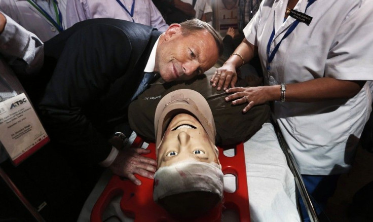 Australia&#039;s Prime Minister Tony Abbott takes part in a presentation with a patient simulator