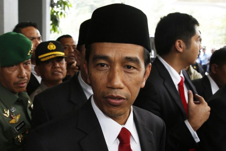 Indonesia's President-elect Joko Widodo looks on after a ceremony inaugurating a new parliament in Jakarta, October 1, 2014. Indonesia inaugurated a new, opposition-dominated parliament on Wednesday, one that is expected to obstruct incoming president Jok