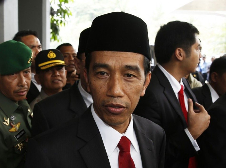 Indonesia's President-elect Joko Widodo looks on after a ceremony inaugurating a new parliament in Jakarta, October 1, 2014. Indonesia inaugurated a new, opposition-dominated parliament on Wednesday, one that is expected to obstruct incoming president Jok