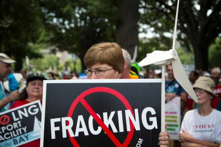 Protesters take part in a rally against U.S. fracked gas exports from the proposed Cove Point facility in Maryland, at a demonstration by several environmental organizations and activists, at the National Mall in Washington July 13, 2014. Cove Point, curr