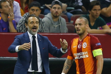 Coach Cesare Prandelli reacts next to Wesley Sneijder of Galatasaray during their Champions League Group D soccer match against Anderlecht in Istanbul September 16, 2014.