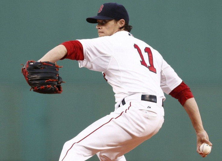 Boston Red Sox starting pitcher Clay Buchholz (11) pitches against the Los Angeles Angels during the first inning at Fenway Park.