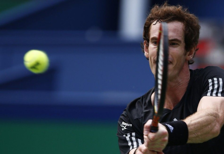 Andy Murray of Britain returns a shot during his men&#039;s singles tennis match against David Ferrer of Spain at the Shanghai Masters tennis tournament in Shanghai October 9, 2014. REUTERS/Aly Song