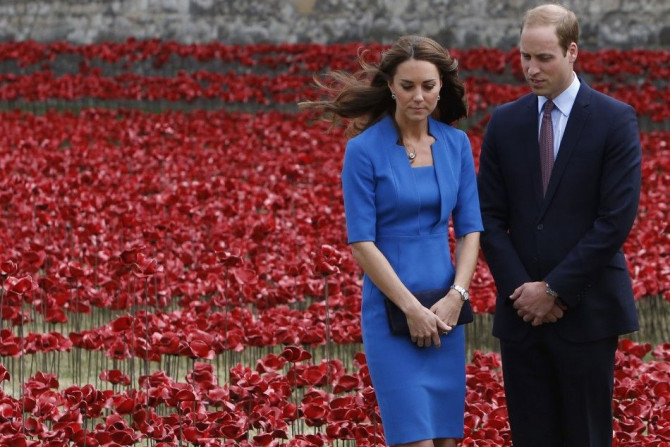 Britain's Prince William and his wife Catherine, Duchess of Cambridge stand amid the Tower of London's 'Blood Swept Lands and Seas of Red' poppy installation to commemorate the 100th anniversary of the outbreak of World War One (WW1), 
