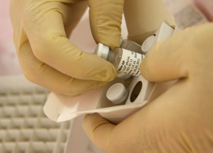 Scientists at the National Microbiology Lab in Winnipeg, Manitoba, prepare an experimental Ebola vaccine for shipment to the World Health Organization (WHO) in Geneva in this undated handout picture released October 18, 2014. 