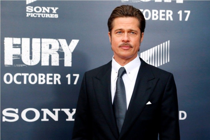 Cast member Brad Pitt arrives on the red carpet at the premiere of World War II film &quot;Fury&quot;