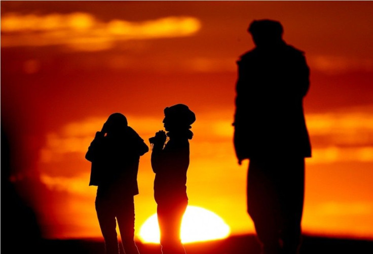 Turkish Kurds watch the Syrian town of Kobani from near the Mursitpinar border crossing