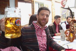 Xabi Alonso of Bayern Munich attends the Oktoberfest beer festival in Munich, October 5, 2014. Millions of beer drinkers from around the world came to the Bavarian capital in the last two weeks for the Oktoberfest.