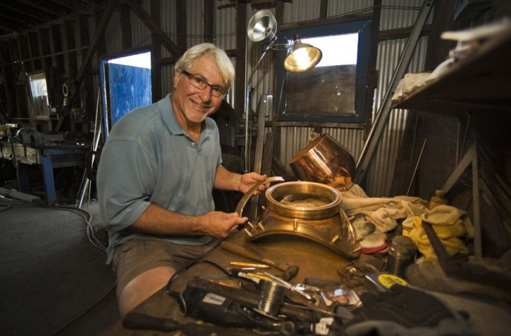 Nicholas Toth works on a breast plate for a diving helmet at his workshop next to the Anticlote River in Tarpon Springs, Florida, April 6, 2014. Toth is among the last to carry on the century-old family skill of hand crafting helmets for sponge divers. He