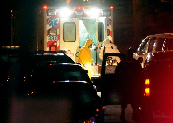 Texas nurse Amber Vinson (L) steps from an ambulance at Emory University Hospital in Atlanta, Georgia October 15, 2014. Vinson, the second Texas nurse who had contracted Ebola was flown to Emory Wednesday after being transferred from Texas Presbyterian Ho