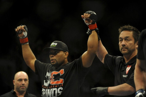 Feb 22, 2014; Las Vegas, NV, USA; Daniel Cormier (red gloves) celebrates his victory of Pactrick Cummins (not pictured) after their UFC light heavyweight bout at Mandalay Bay. Cormier won by way of a TKO in the first round.