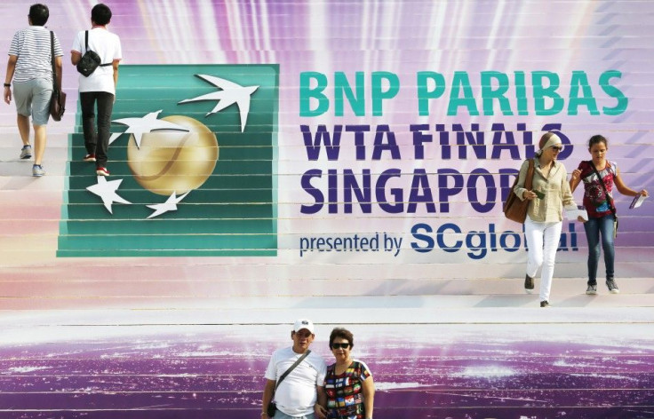 Spectators arrive at the venue of the WTA Finals in Singapore October 20, 2014. The top eight women in world tennis have limped to the season-ending WTA Finals in Singapore this week, with creaking knees and form fears casting a shadow over the WTA&#039;s