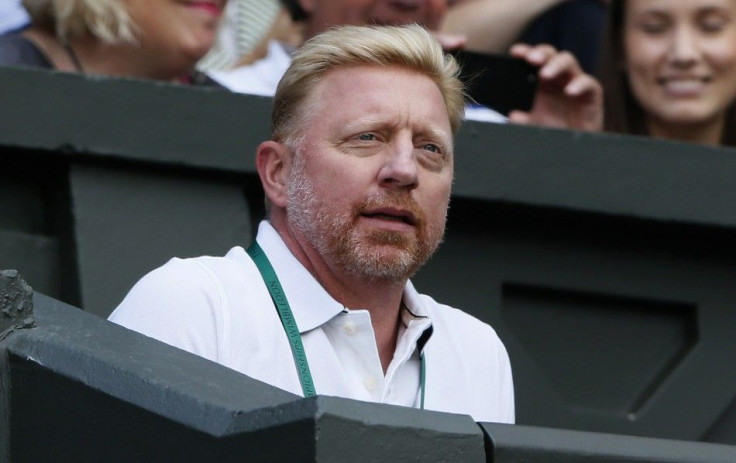 Boris Becker, the coach of Novak Djokovic of Serbia, takes his seat at the Wimbledon Tennis Championships in London June 27, 2014. REUTERS/Stefan Wermuth