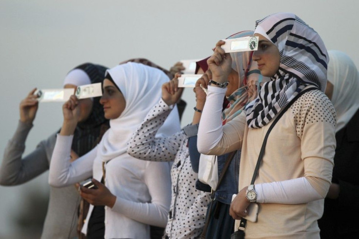 People Observing A Solar Eclipse