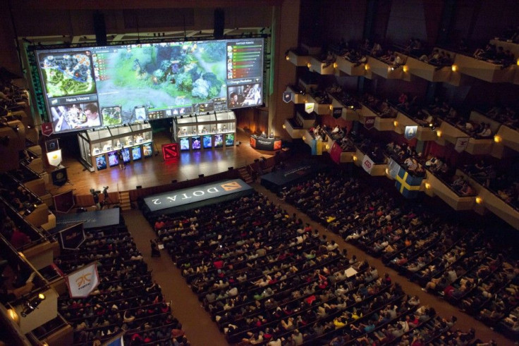 People sit in Benaroya Hall during &quot;The International&quot; Dota 2 video game competition in Seattle, Washington August 11, 2013. Sixteen teams from 12 countries battled for some $2.9 million in prize money, with Swedish team &#039;The Alliance&#039;
