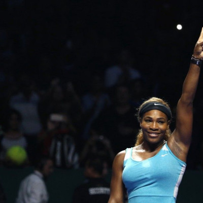 Serena Williams of the U.S. celebrates her victory against Ana Ivanovic of Serbia during their WTA Finals singles tennis match in Singapore October 20, 2014. REUTERS/Edgar Su