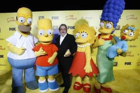 Matt Groening (C), creator of The Simpsons, poses with characters