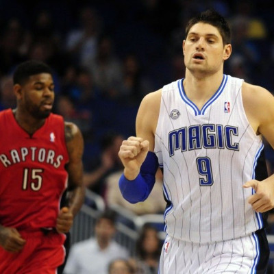 Orlando Magic's Nikola Vucevic (9) Scores In The First Half Against The Toronto Raptors