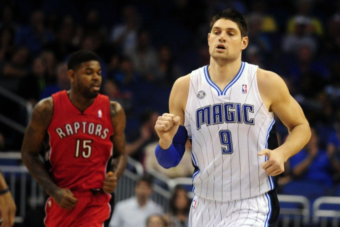 Orlando Magic's Nikola Vucevic (9) Scores In The First Half Against The Toronto Raptors