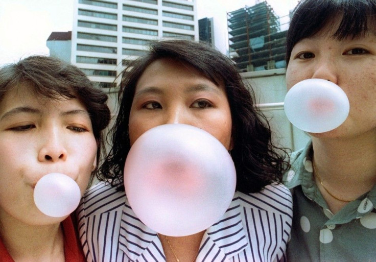 Singaporeans pose while blowing bubbles in this early January 1992 photograph